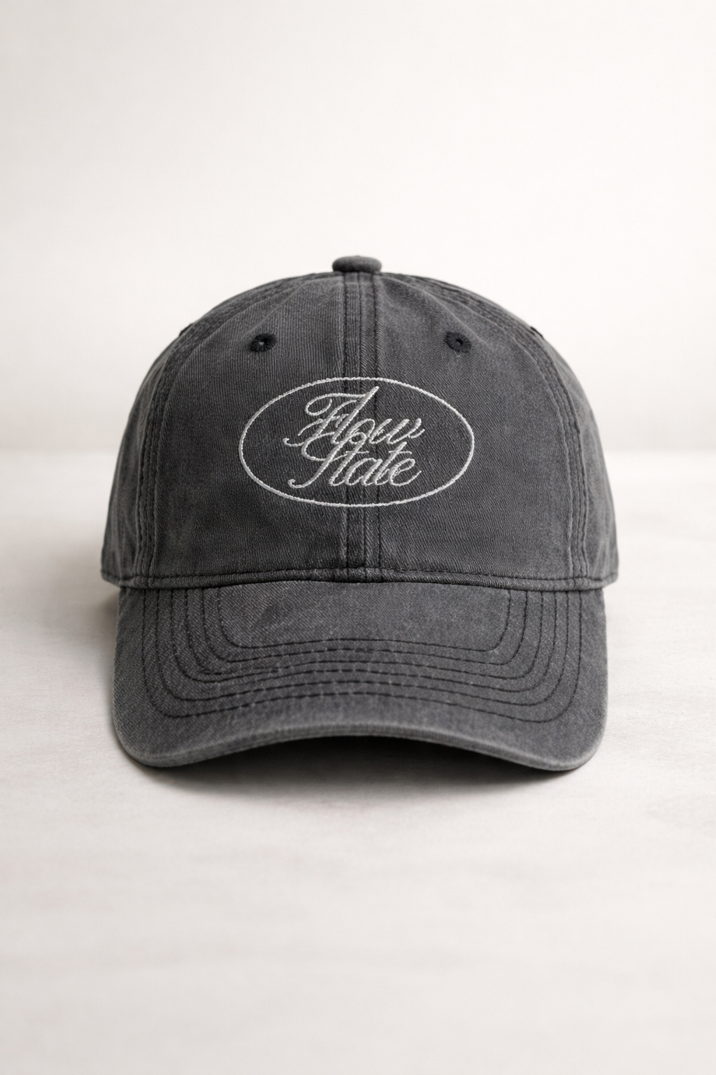 dark grey vintage washed cotton cap with embroidered Flow State logo